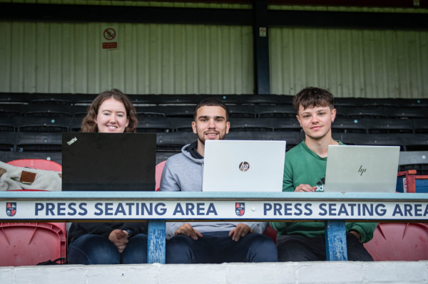 Laura Howard with colleagues Eduardo Tansley and Oscar Pick covering a Hampton and Richmond FC match. Credit: Thomas Lang